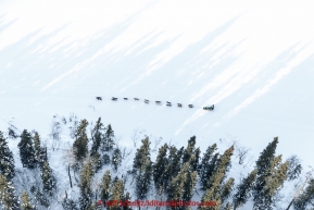 A team runs down the Tanana River on their way to the first checkpoint in Nenana on March 9th, 2015 during the 2015 Iditarod.(C) Jeff Schultz/SchultzPhoto.com - ALL RIGHTS RESERVED DUPLICATION  PROHIBITED  WITHOUT  PERMISSION