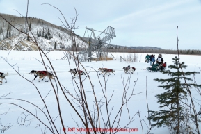 Rookie musher Laura Allaway runs past a fish wheel on the banks of the Tanana River as she approaches the first checkpoint of Nenana on March 9th, 2015 during the 2015 Iditarod.(C) Jeff Schultz/SchultzPhoto.com - ALL RIGHTS RESERVED DUPLICATION  PROHIBITED  WITHOUT  PERMISSION