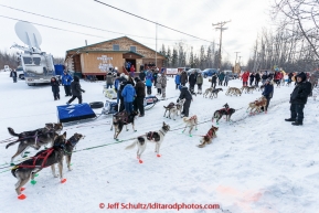 Three teams check in at the community center at the first checkpoint in Nenana on March 9th, 2015 during the 2015 Iditarod.(C) Jeff Schultz/SchultzPhoto.com - ALL RIGHTS RESERVED DUPLICATION  PROHIBITED  WITHOUT  PERMISSION