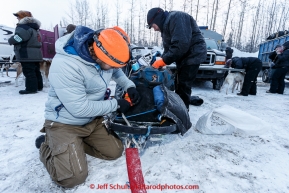 Aren Gunderson helps musher Jim Lanier pack his sled before the offical start of the 2015 Iditarod in Fairbanks, Alaska.(C) Jeff Schultz/SchultzPhoto.com - ALL RIGHTS RESERVED DUPLICATION  PROHIBITED  WITHOUT  PERMISSION