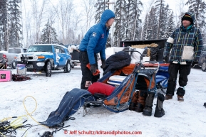 Christian Turner doing some last minute packing at the offical start of the 2015 Iditarod in Fairbanks, Alaska.(C) Jeff Schultz/SchultzPhoto.com - ALL RIGHTS RESERVED DUPLICATION  PROHIBITED  WITHOUT  PERMISSION