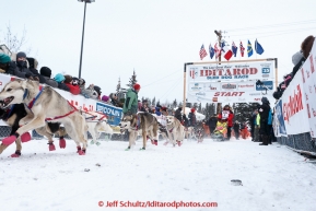 Alan Eischens crossing the starting line at the offical start of the 2015 Iditarod in Fairbanks, Alaska.(C) Jeff Schultz/SchultzPhoto.com - ALL RIGHTS RESERVED DUPLICATION  PROHIBITED  WITHOUT  PERMISSION