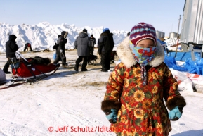 3 year old Melody Jackson watches teams resting at Shaktoolik on Monday March 11, 2013.Iditarod Sled Dog Race 2013Photo by Jeff Schultz copyright 2013 DO NOT REPRODUCE WITHOUT PERMISSION