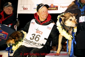 Mitch Seavey with his lead dogs Tanner, left, and Taurus after arriving in Nome first and winning his second Iditarod sled dog race on Tuesday March 12, 2013. Seavey made the journey from Willow in 9 days, 7 hours, 39 minutes, 56 seconds. Iditarod Sled Dog Race 2013Photo by Jeff Schultz copyright 2013 DO NOT REPRODUCE WITHOUT PERMISSION