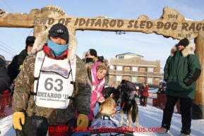 Russian musher Mikhail Telpin at the finish line on Front Street in Nome. Iditarod Sled Dog Race 2013Photo by Jeff Schultz copyright 2013 DO NOT REPRODUCE WITHOUT PERMISSION