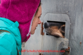 Iditarod Vet Check in Wasilla, AlaskaIditarod Sled Dog Race 2014Stephanie Bartelman, from Quinhagak, Alaska, greets a dog at the Vet Check at race headquarters in Wasilla, Alaska, on February, 26, 2014.PHOTO (c) BY JEFF SCHULTZ -- REPRODUCTION PROHIBITED WITHOUT PERMISSION