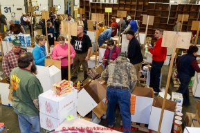 Volunteers sort, stack and box