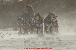 Michelle Phillips team breaks drifted in trail several miles after leaving the Unalakleet checkpoint on Monday March 16, 2015 during Iditarod 2015.  (C) Jeff Schultz/SchultzPhoto.com - ALL RIGHTS RESERVED DUPLICATION  PROHIBITED  WITHOUT  PERMISSION