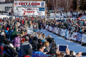 Michelle Phillips leaves the start line amongst a crow of spectaors during the Restart of the 2016 Iditarod in Willow, Alaska.  March 06, 2016.