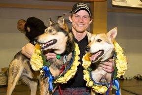 2016 Iditarod Champion Dallas Seavey poses with his lead dogs Reef and Tide at the musher awards banquet in Nome after the 2016 Iditarod.  Alaska    Photo by Jeff Schultz (C) 2016  ALL RIGHTS RESERVED