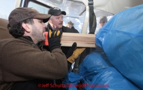 Saturday February 18, 2012  Chief pilot Bert Hanson helps pilot Wes Erb load his plane at the Willow airport as the straw, musher food bags, lathe, people food and supplies begin to be flown out by the Iditarod volunteer Air Force  to checkpoints along the trail.
