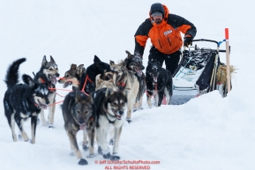 Pete Kaiser and team run up the bank from the Yukon River and into the Kaltag checkpoint on Saturday March 9th during the 2019 Iditarod Trail Sled Dog Race.Photo by Jeff Schultz/  (C) 2019  ALL RIGHTS RESERVED