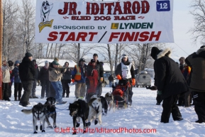 Saturday February 25, 2012   Grayson Bruton leaves the start line at Knik Lake during the Junior Iditarod start.