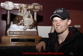 Sunday March 18, 2012   Dallas Seavey poses with his 1st place Joe Redington Sr. award at the musher's finisher banquet in Nome after Iditarod 2012.