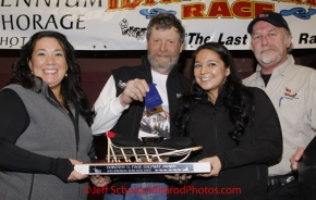 Sunday March 18, 2012   Jim Lanier recieves the GCI Dorothy G. Page half-way award at the musher's finisher banquet in Nome after Iditarod 2012.