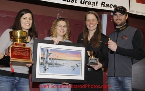 Sunday March 18, 2012  Aliy Zirkle recieves the Wells Fargo Gold Coast award for first musher to the Bering Sea coast at the musher's finisher banquet in Nome after Iditarod 2012.