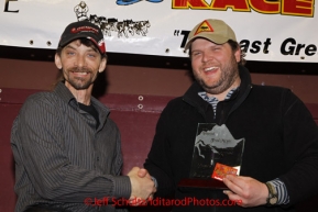 Sunday March 18, 2012  Lance Mackey recieves the Sportsmanship award from Bill Gallea at the musher's finisher banquet in Nome after Iditarod 2012.