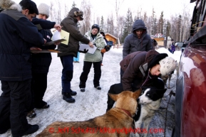 Veterinarians, including Leah Ravitz, left, perform mandatory vet checks on dogs in Wasilla Wednesday, Feb. 27, 2013.