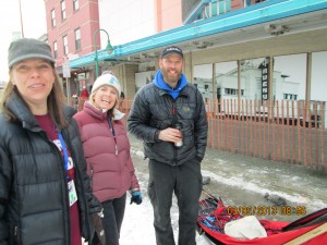 Mike Ellis at right waiting to harness his Siberian huskies