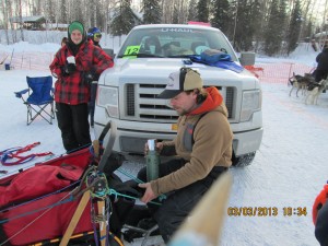 jason sitting on sled seat for a cup of tea, recreating  nightmare on the trail