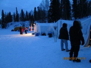 camp finger lake assembled on ice of lake, houses 22 but will accept 66 mushers in next 24 hours