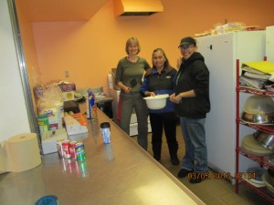 lft to rt, Joyce Cordella,Oline Ticknor, and Shelmarie Nikoai organize kitchen for musher breakfast