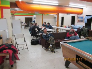 interior of unk checkpoint.  Fans and volunteers are already gathering for the first musher to the coast.  The people of UNK gather in great numbers for the first musher---maybe 7AM