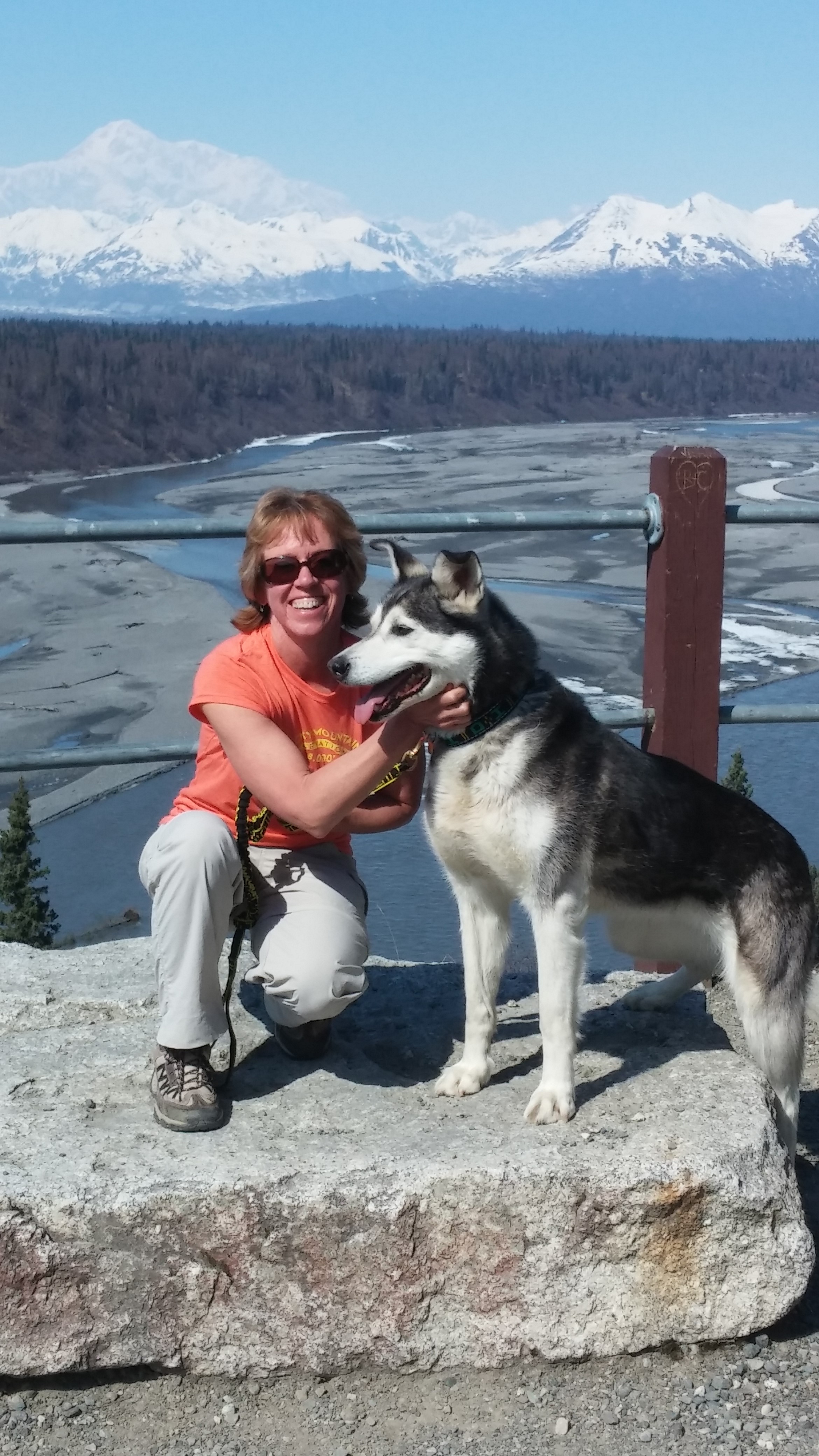 Sharon and Aurora on retirement day!  Check out Denali in the background!