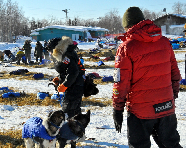 Lance (red) watching on as Jason prepares to leave Huslia.
