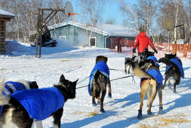 Lance leading Jason out of Huslia.