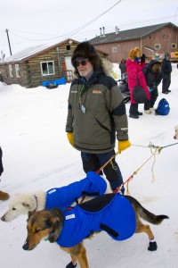 Race Judge Al Marple holds Jason Barron's lead dogs during Jason's brief stop to check in at Shageluk